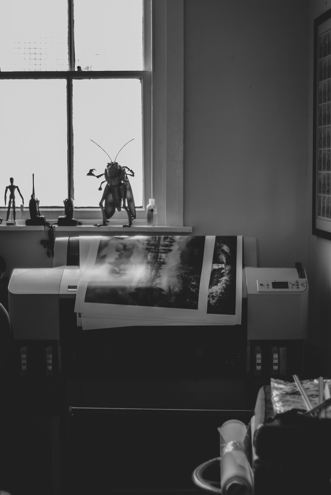 Cozy photography studio interior with prints on the wall
