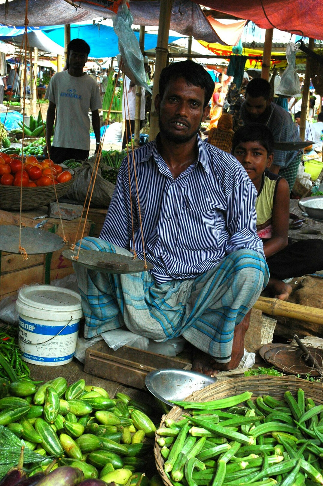 Danish market vendor at his fruit and vegetable stall