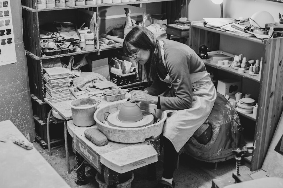 Danish ceramic artisan working in her workshop