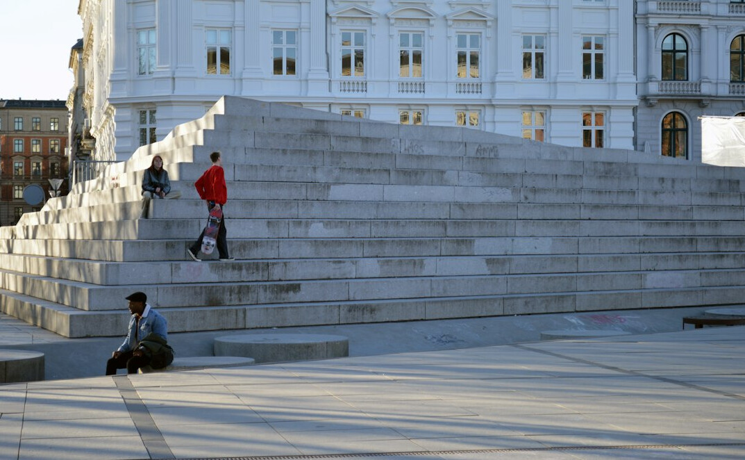 Young Danish street musician playing guitar